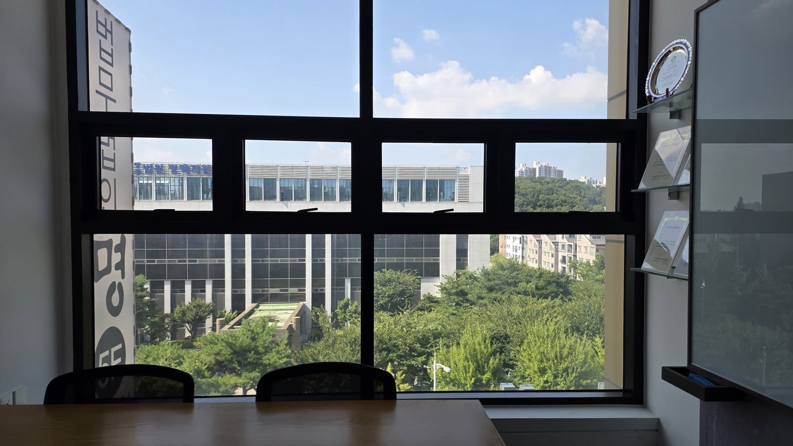 The consultation table at SOL & LUNA, with the Pyeongtaek courthouse visible through the window